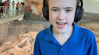 Quilla shows how her autistic son wears the AngelSense GPS tracking device